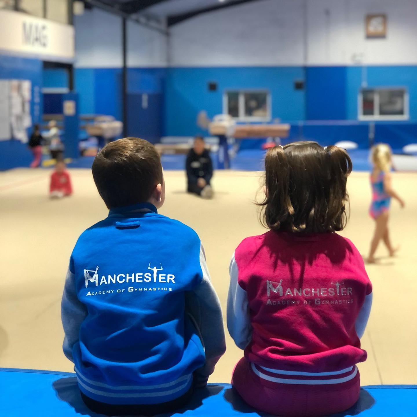 Young Manchester Academy of Gymnastics members together at the academy